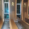 Wall adorned with arches and images of Stations of the Cross