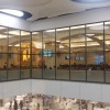 The main nave of Mary Mother of Hope Chapel as seen from the children's area. It is enclosed by glasses due to the opening on the floor where the third floor department store is visible.