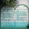 Two tablets of the Ten Commandments outside the San Isidro Parish's church structure. The stones are white, surrounded by a cyan border, and the text is also cyan. The labels at the bottom, which labels the commandments as 'for God' and 'for humans' reverse this color scheme: cyan background and white text.